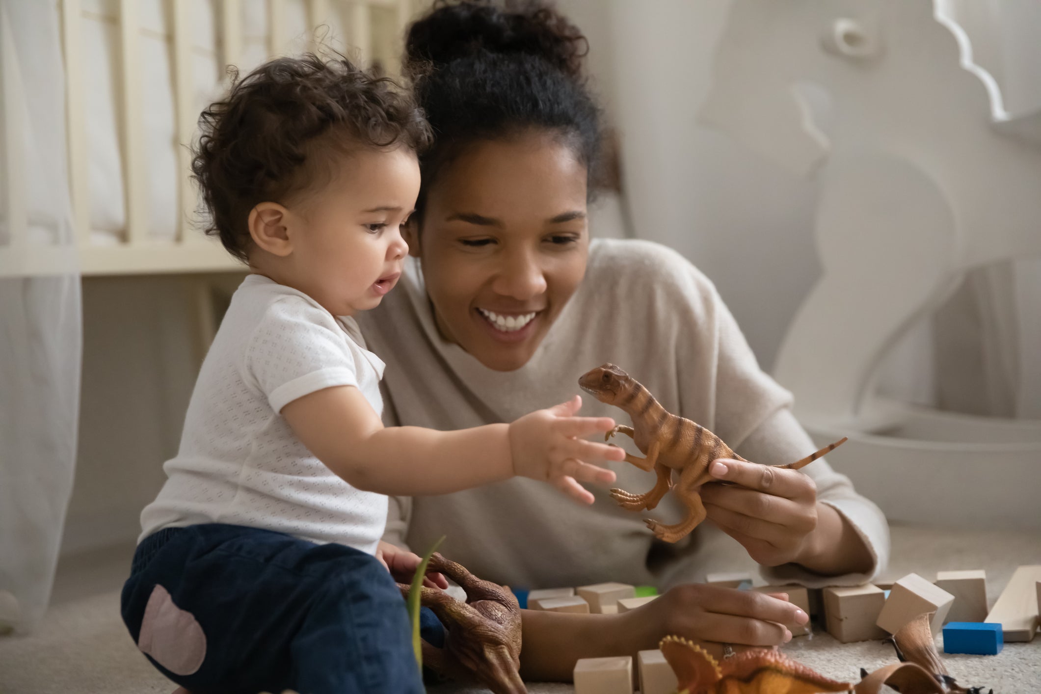 Mum and baby playing toys