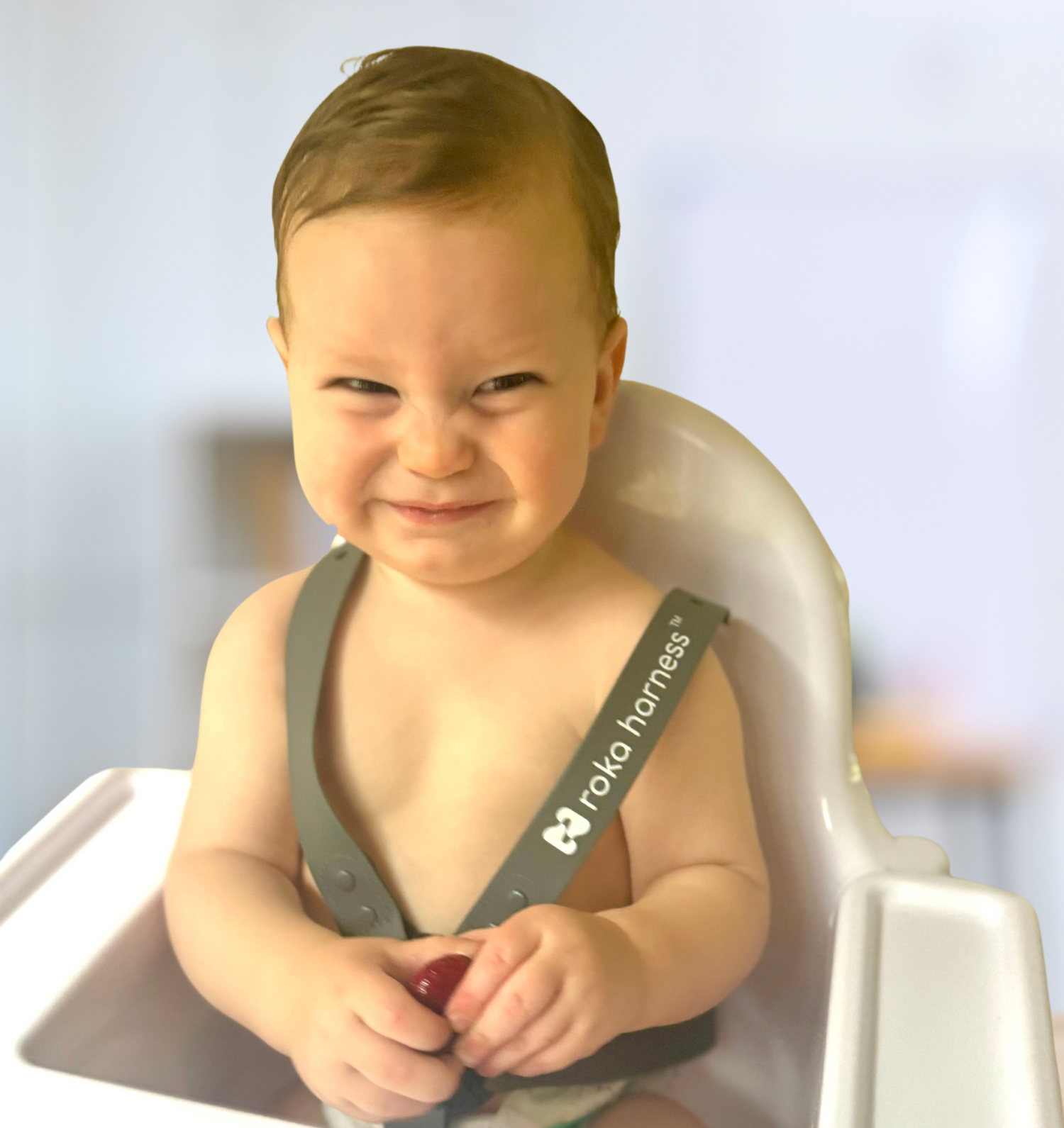 baby smiling with no shirt harness soft on baby skin